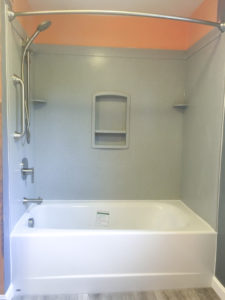 Swanstone tub surround and an Americast tub